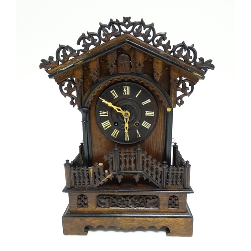 1650A - A 20thC oak cased Black Forest cuckoo clock. Approx 20 1/2