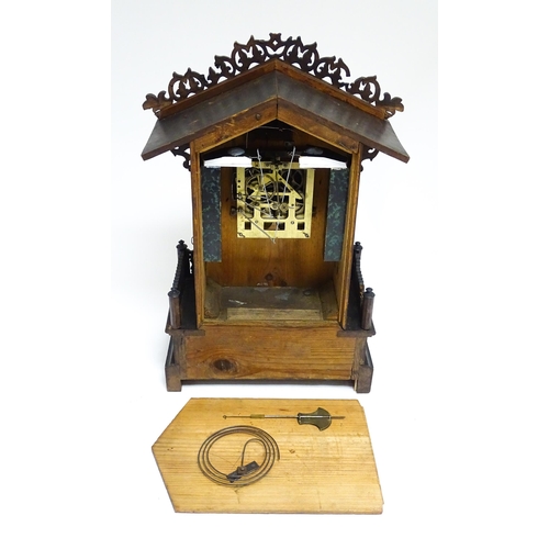 1650A - A 20thC oak cased Black Forest cuckoo clock. Approx 20 1/2