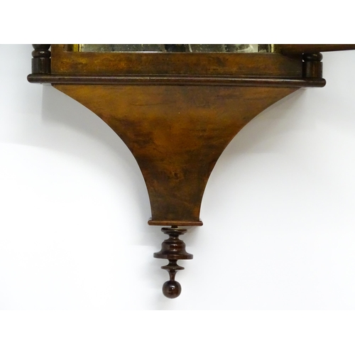 1656 - A Victorian 8-day wall clock, the walnut veneered case with twist columns surmounted by a cross form... 