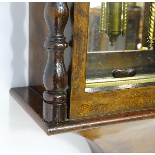 1656 - A Victorian 8-day wall clock, the walnut veneered case with twist columns surmounted by a cross form... 