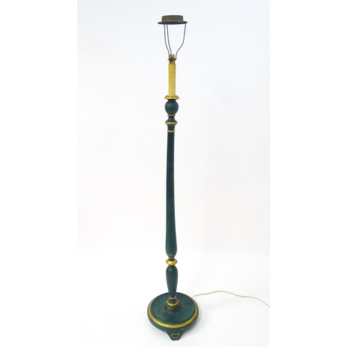 1668 - A turned wooden standard lamp with painted teal and gilt finish. Approx. 62