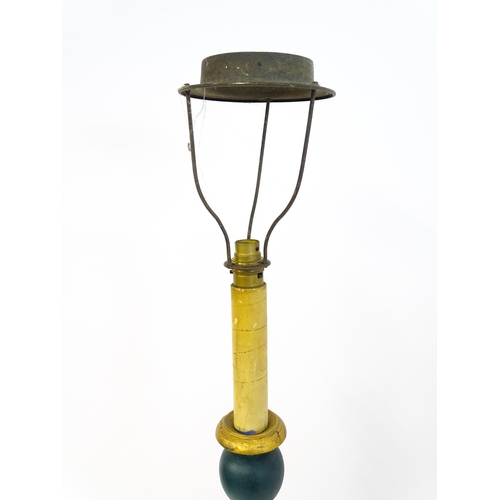 1668 - A turned wooden standard lamp with painted teal and gilt finish. Approx. 62