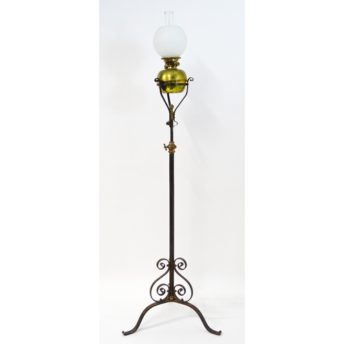 1669 - An Art Nouveau adjustable oil lamp with glass shade. Approx. 72 1/2