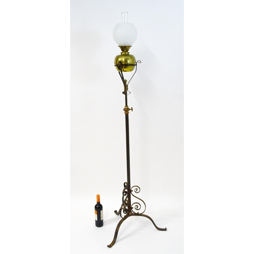 1669 - An Art Nouveau adjustable oil lamp with glass shade. Approx. 72 1/2