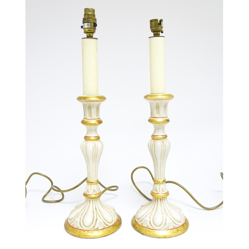 1670 - A pair of 20thC table lamps of candlestick form with gilt, cream and red detail. Approx. 19