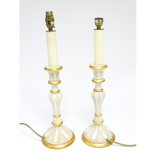 1670 - A pair of 20thC table lamps of candlestick form with gilt, cream and red detail. Approx. 19