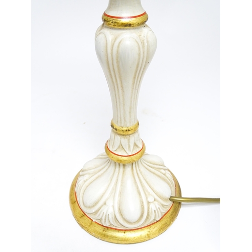 1670 - A pair of 20thC table lamps of candlestick form with gilt, cream and red detail. Approx. 19