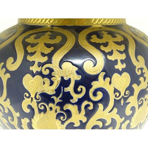 1671 - A large 20thC table lamp formed as a Chinese jar and cover, the blue ground with gilt floral and fol... 