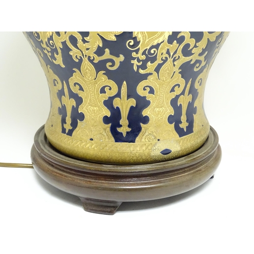 1671 - A large 20thC table lamp formed as a Chinese jar and cover, the blue ground with gilt floral and fol... 