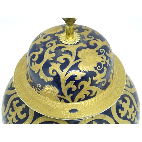 1671 - A large 20thC table lamp formed as a Chinese jar and cover, the blue ground with gilt floral and fol... 