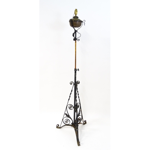 1677 - An Art Nouveau telescopic standard lamp with floral and scroll detail. Approx. 58