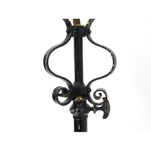 1677 - An Art Nouveau telescopic standard lamp with floral and scroll detail. Approx. 58