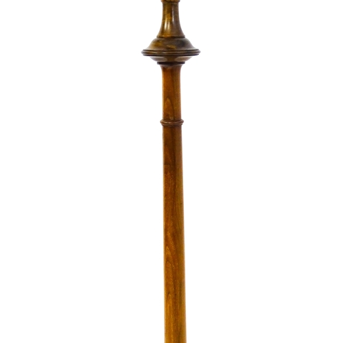 1683 - A turned wooden standard lamp raised on squat bun feet. Approx. 62