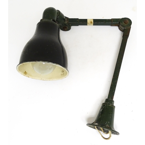 1686 - A vintage industrial green painted adjustable lamp.