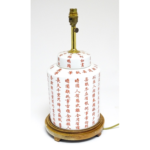 1690 - A 20thC table lamp formed as a Chinese jar and cover decorated with red Chinese character marks. On ... 