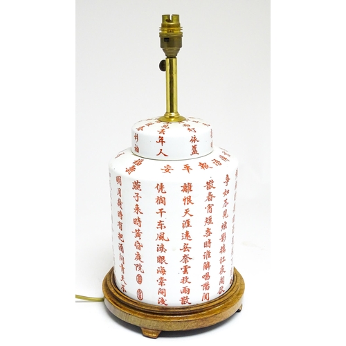 1690 - A 20thC table lamp formed as a Chinese jar and cover decorated with red Chinese character marks. On ... 