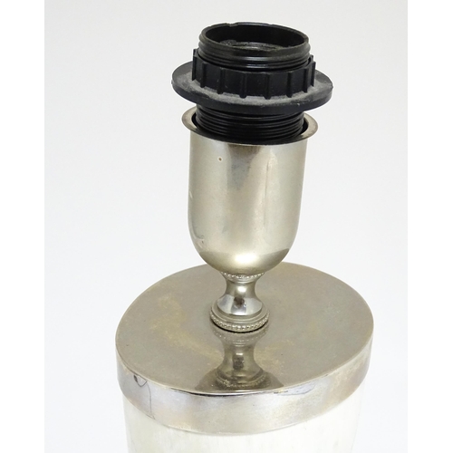 1694 - A 20thC table lamp the body of horn form, mounted on a weight silver plate base. Approx. 29