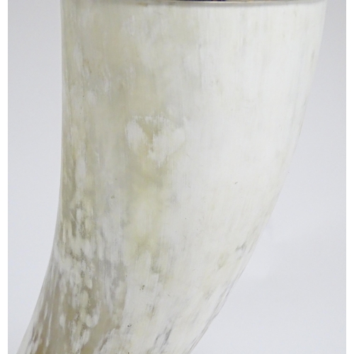 1694 - A 20thC table lamp the body of horn form, mounted on a weight silver plate base. Approx. 29