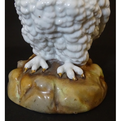 1697 - A novelty oil lamp the ceramic base formed as an owl with glass eyes. Marked under. Approx. 14 1/2