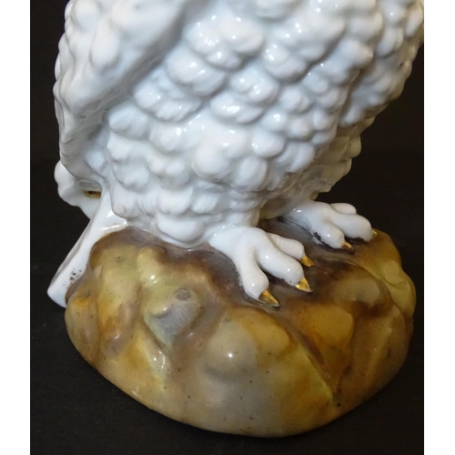 1697 - A novelty oil lamp the ceramic base formed as an owl with glass eyes. Marked under. Approx. 14 1/2