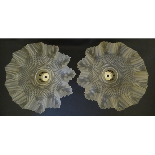 1702 - A pair of frosted glass light shades with frilled and lattice detail and chrome mounts. Approx. 11