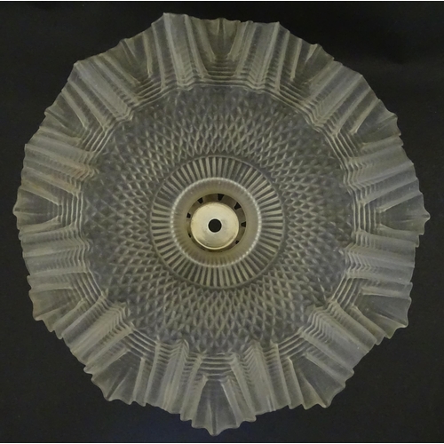 1702 - A pair of frosted glass light shades with frilled and lattice detail and chrome mounts. Approx. 11