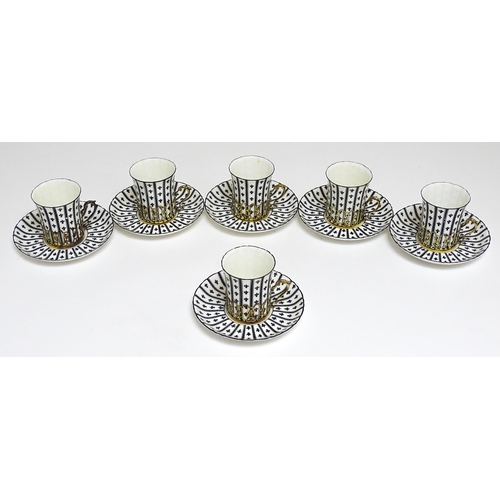 617 - An early 20thC Royal Worcester set of six coffee cups and saucers with black and white decoration, w... 