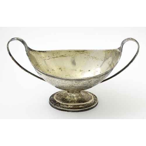 621 - A silver twin handled pedestal boat shaped dish, hallmarked London 1905 maker C S Harris & Sons Ltd.... 