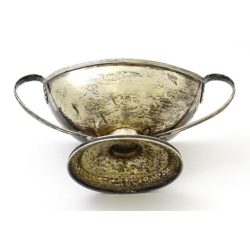 621 - A silver twin handled pedestal boat shaped dish, hallmarked London 1905 maker C S Harris & Sons Ltd.... 