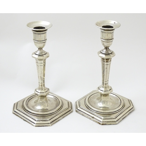 623 - A pair of silver candlesticks hallmarked Sheffield 1927 / 1928, maker James Dixon & Sons. Approx. 8