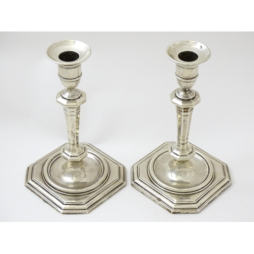 623 - A pair of silver candlesticks hallmarked Sheffield 1927 / 1928, maker James Dixon & Sons. Approx. 8