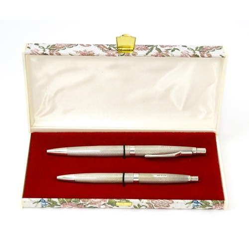 655 - Two silver pens with engine turned decoration hallmarked Birmingham 1976, maker William Manton. Larg... 