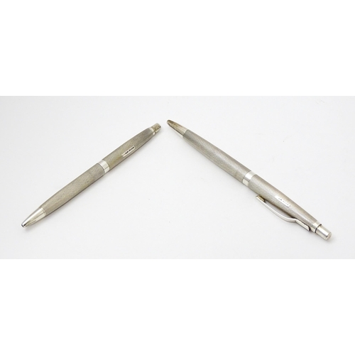 655 - Two silver pens with engine turned decoration hallmarked Birmingham 1976, maker William Manton. Larg... 