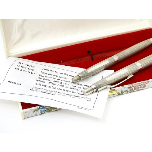 655 - Two silver pens with engine turned decoration hallmarked Birmingham 1976, maker William Manton. Larg... 