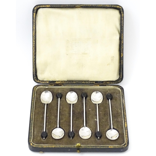 656 - A set of six silver coffee spoons with coffee bean finials, hallmarked Sheffield 1922, maker C. W. F... 