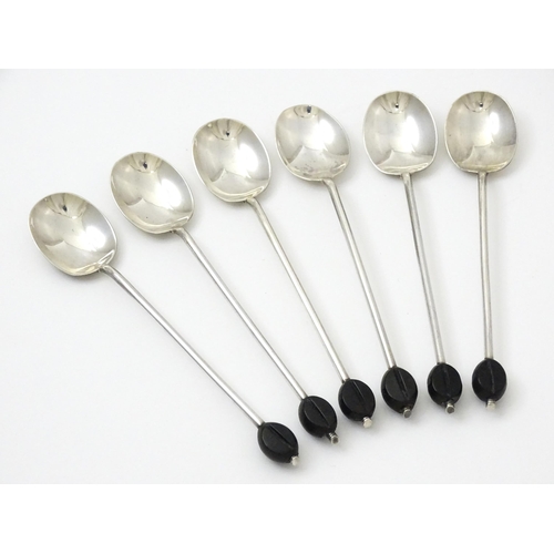 656 - A set of six silver coffee spoons with coffee bean finials, hallmarked Sheffield 1922, maker C. W. F... 