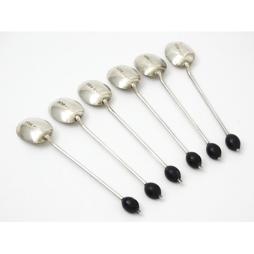 656 - A set of six silver coffee spoons with coffee bean finials, hallmarked Sheffield 1922, maker C. W. F... 