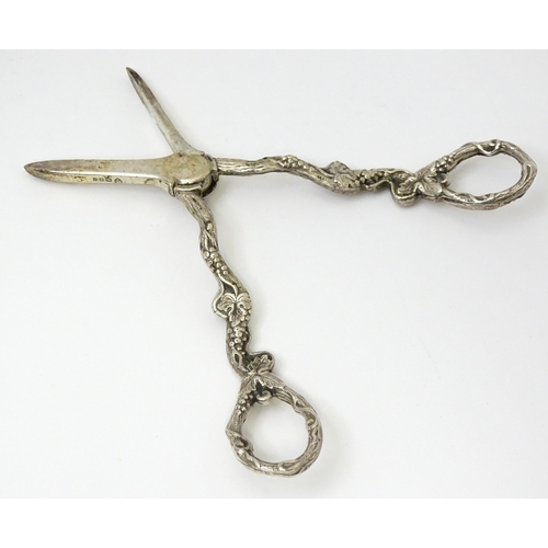 661 - Cased silver grape shears with fruiting vine decoration hallmarked London 1966, maker D. J. Silver R... 