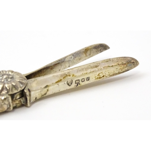 661 - Cased silver grape shears with fruiting vine decoration hallmarked London 1966, maker D. J. Silver R... 