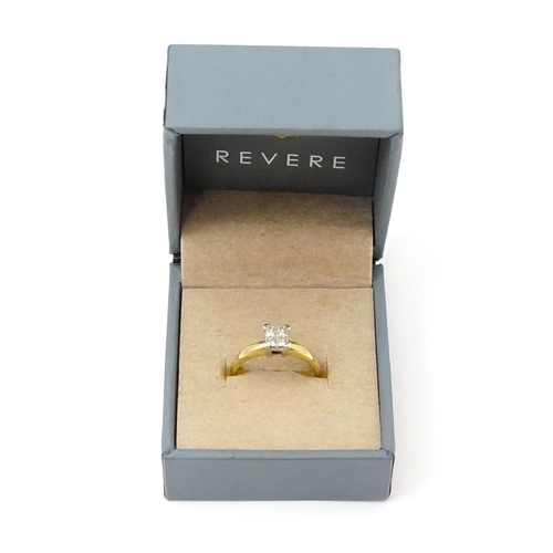 774 - A 9ct gold ring set with four diamonds in a square setting. Ring size approx. K 1/2