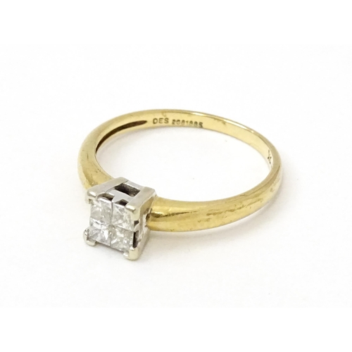 774 - A 9ct gold ring set with four diamonds in a square setting. Ring size approx. K 1/2