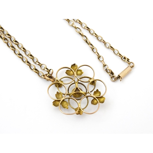 778 - An Art Nouveau 9ct gold pendant of stylised floral form set with central amethyst, with a 9ct gold c... 