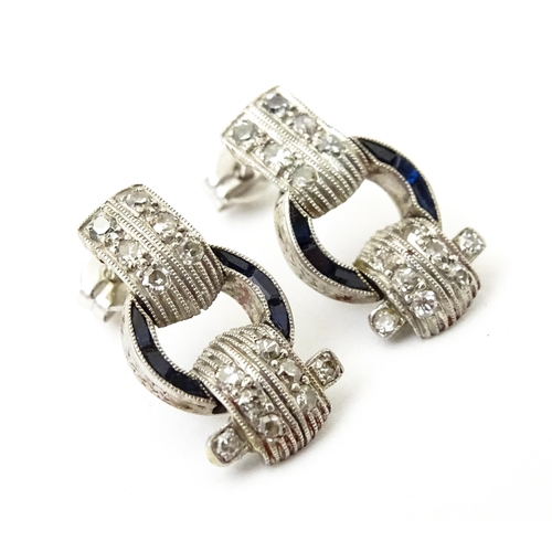 783 - A pair of Art deco style earrings set with  diamonds and sapphires. Approx 1/2