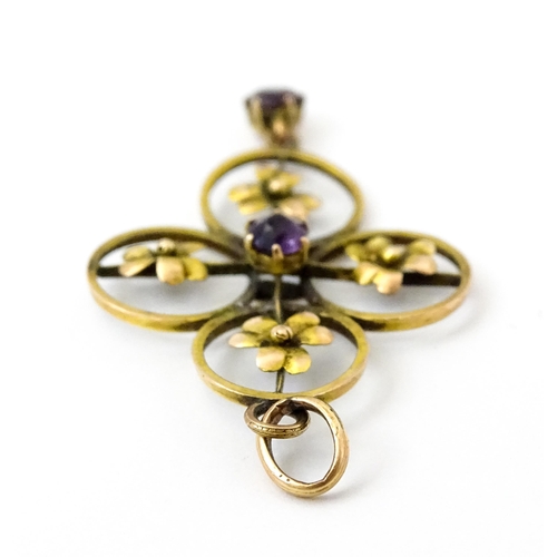 788 - A 9ct gold Art Nouveau pendant set with floral detail, amethyst to centre and amethyst drop. Approx ... 