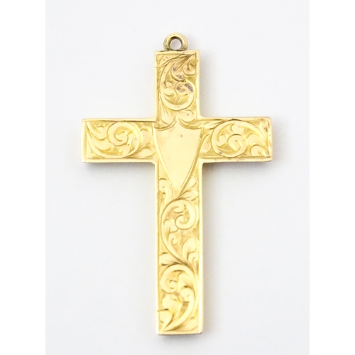 789 - A 9ct gold pendant of cross form with engraved foliate decoration hallmarked Chester 1919, maker J &... 