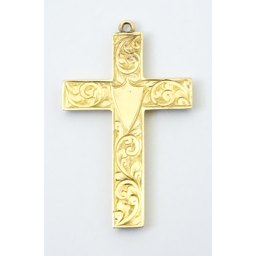 789 - A 9ct gold pendant of cross form with engraved foliate decoration hallmarked Chester 1919, maker J &... 