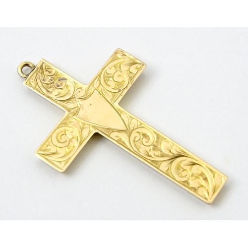 789 - A 9ct gold pendant of cross form with engraved foliate decoration hallmarked Chester 1919, maker J &... 