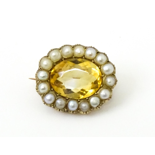 790 - A 19thC brooch set with central citrine bordered by pearls. Approx 1