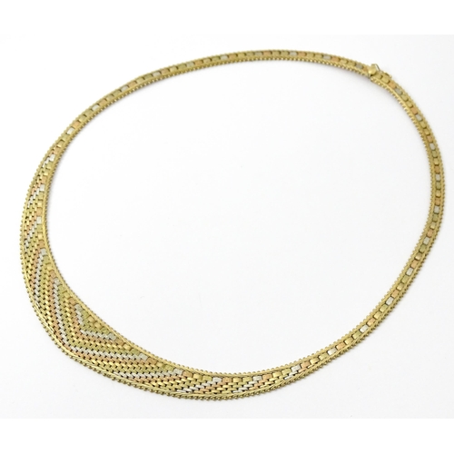 791 - A 9ct gold necklace with tricolour yellow white and rose gold detail. Approx 17