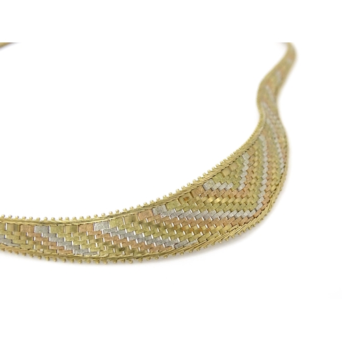 791 - A 9ct gold necklace with tricolour yellow white and rose gold detail. Approx 17